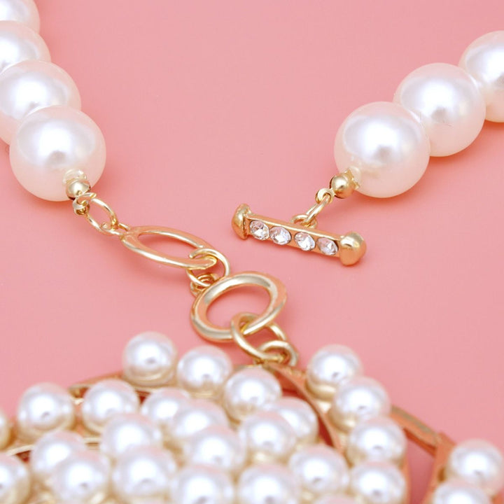 Toggle Gold Swirled Circle Chunky Pearl Necklace